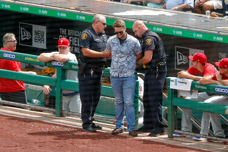 Illustration for article titled Nonchalant Idiot On The Field Arrested For Picking Inopportune Time To Say Hello To Phillies' Brad Miller